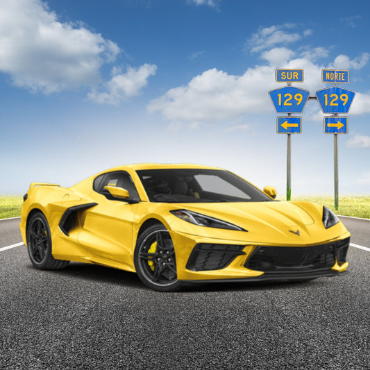 Yellow sports car on a road with highway signs in the background